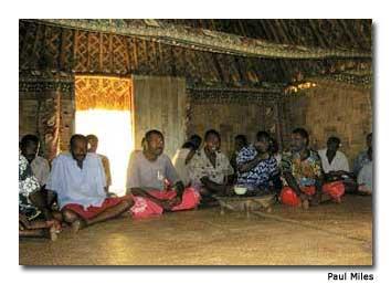 The men of the village conduct the Yaqona (kava) welcome ceremony inside the Chief’s bure.